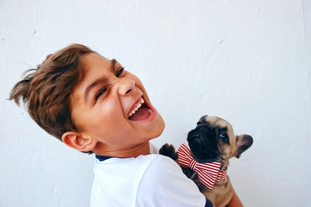 kid with puppy